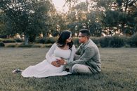 Couple Sitting on Green Grass Field