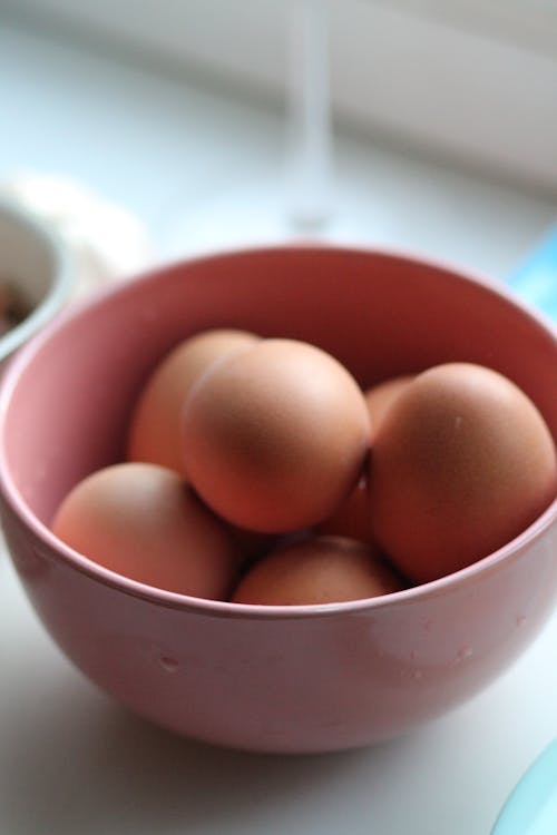 Free Brown Eggs in Red Ceramic Bowl Stock Photo