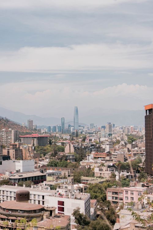 Free Aerial view of Santiago, Chile featuring skyscrapers and urban landscape under a blue sky. Stock Photo