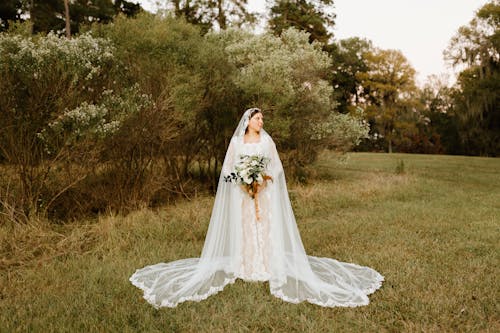 Bride Standing in a Park