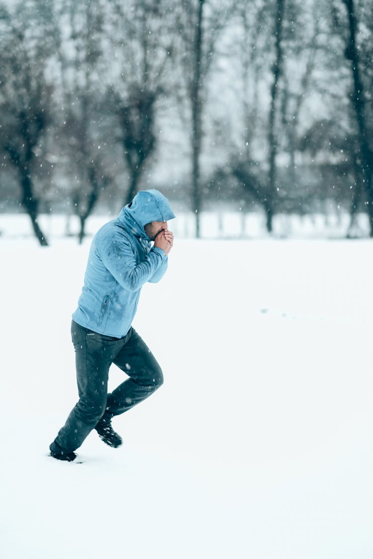 A Man Running On The Snow 