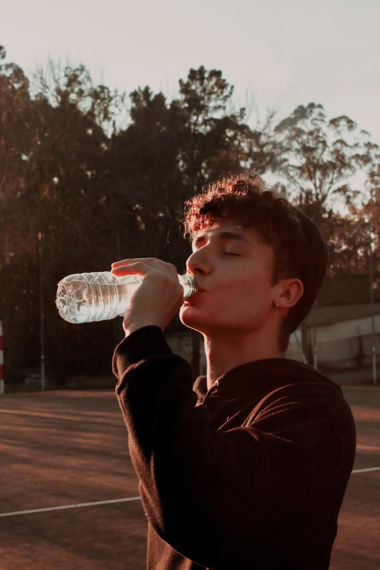 Portrait Of Man Drinking Water