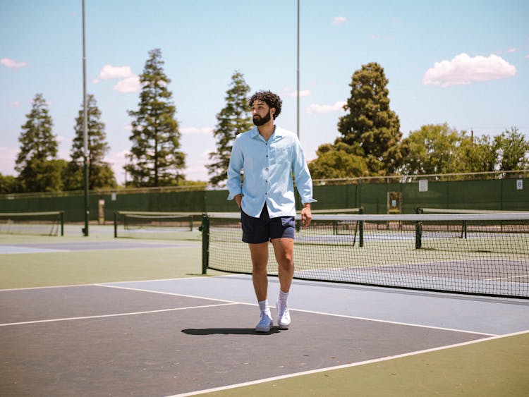 Man On A Tennis Court