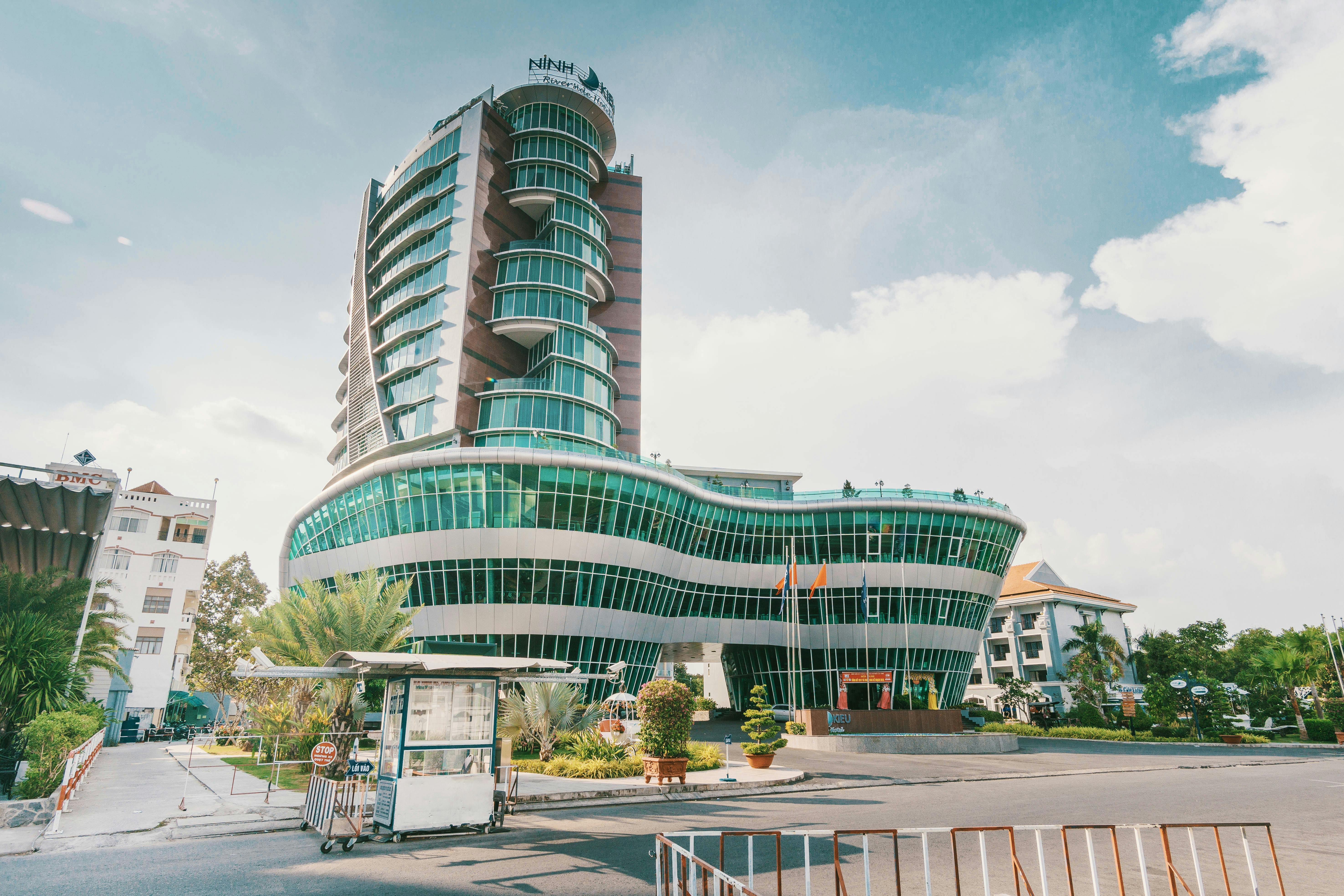 High Rise Building With Green Glass Windows · Free Stock Photo