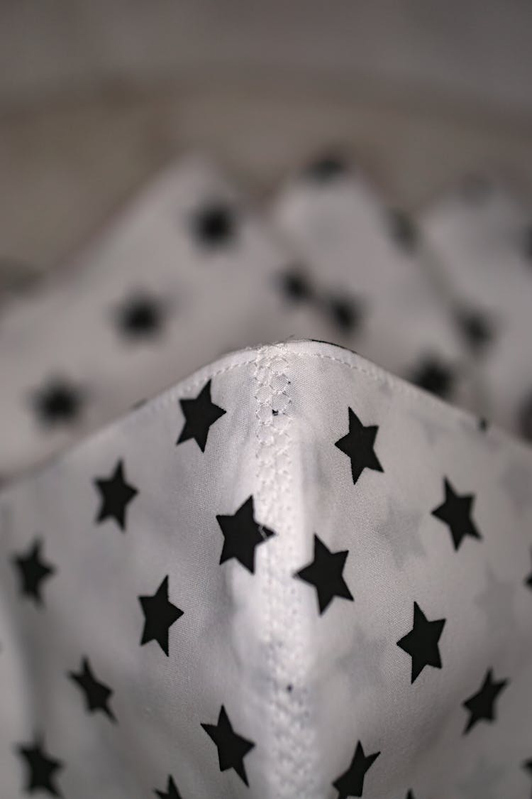 A White Fabric With Black Star Print
