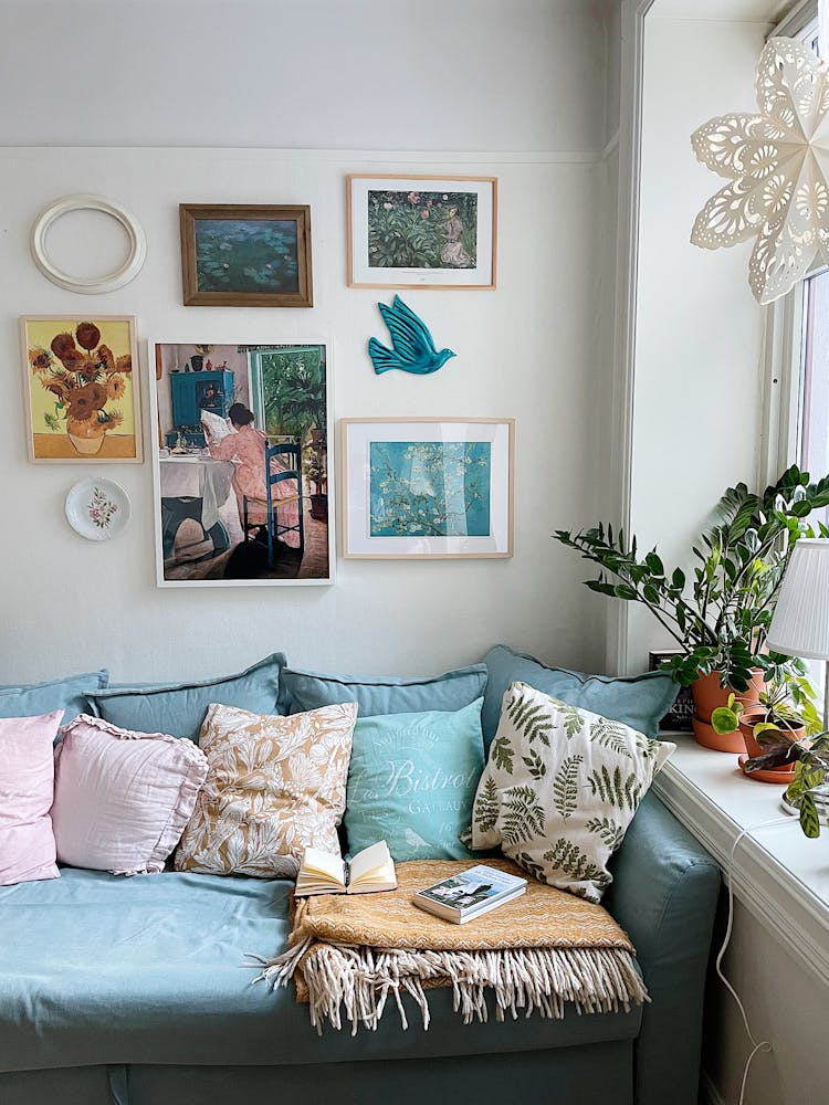 Sofa And Paintings On A Wall