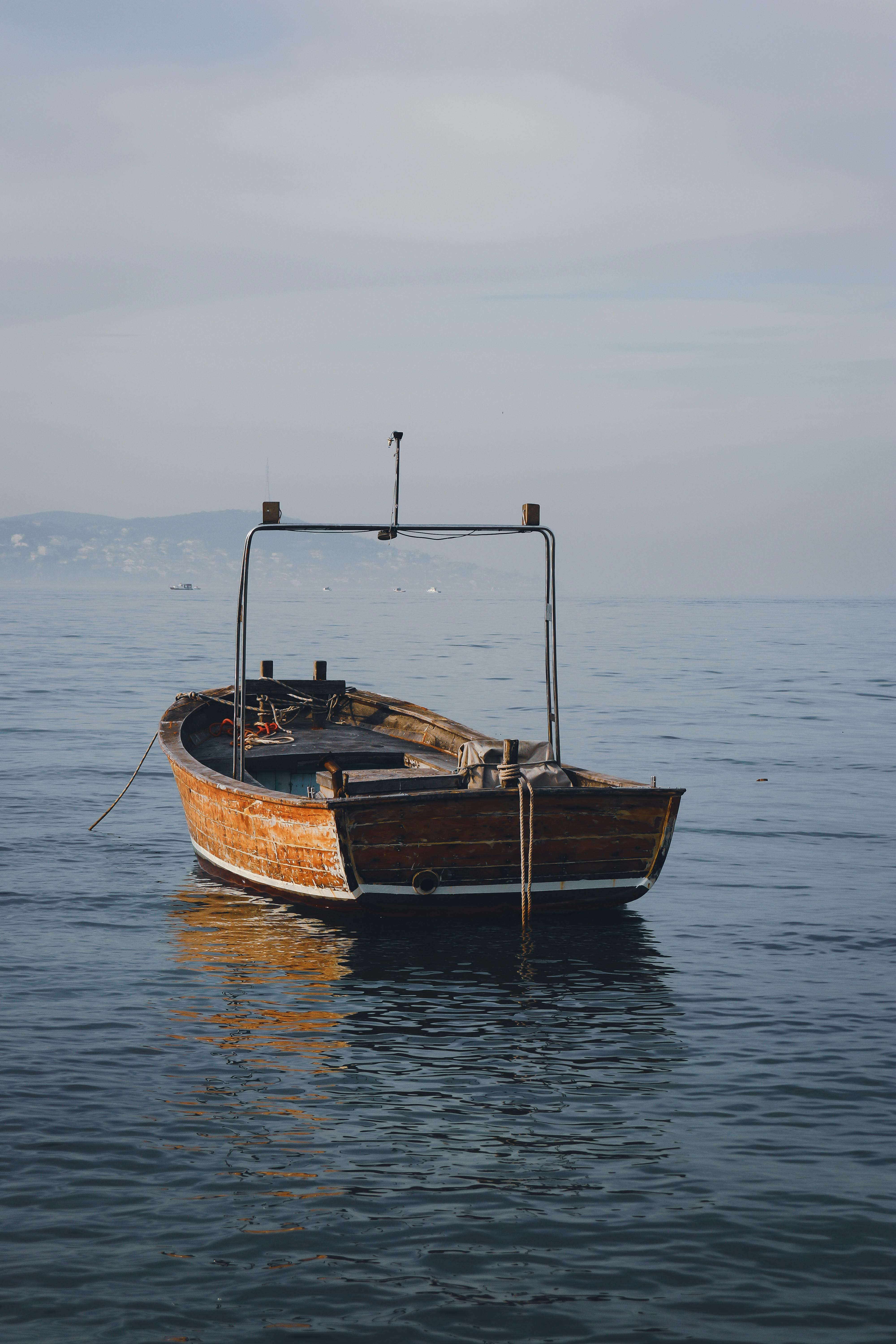 Photo Of Boat On Body Of Water · Free Stock Photo