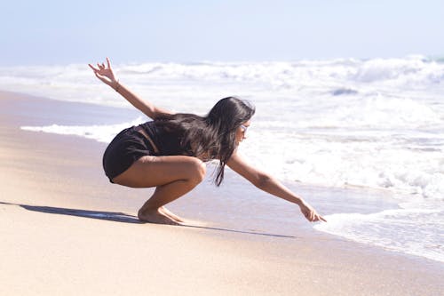 Free Woman on Seashore Stock Photo
