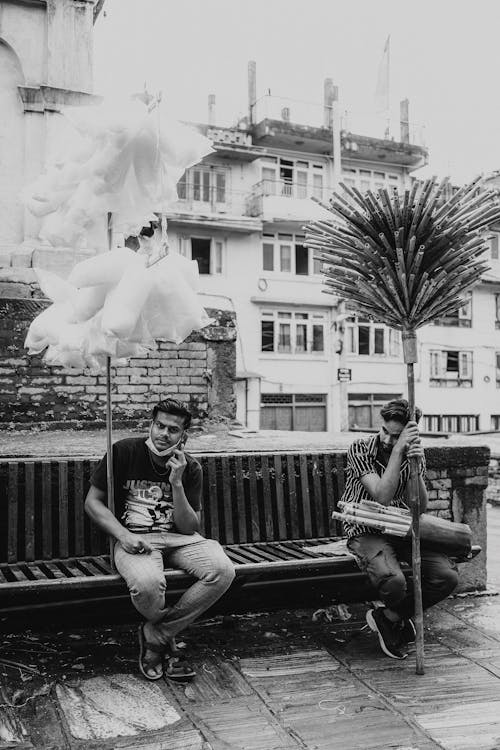 Men Sitting Together on a Bench