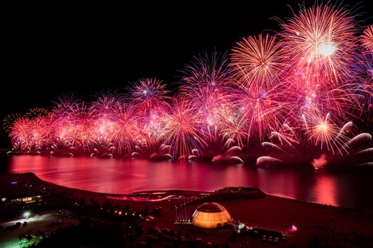 Spectacular fireworks display over the water in Ras Al-Khaimah, creating a vibrant New Year's celebration ambiance.