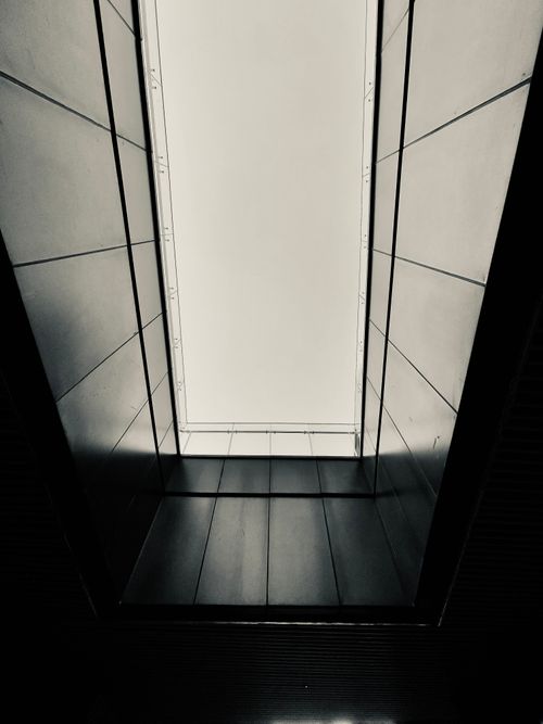 Free Black and white view of a geometric skylight in contemporary architecture. Stock Photo