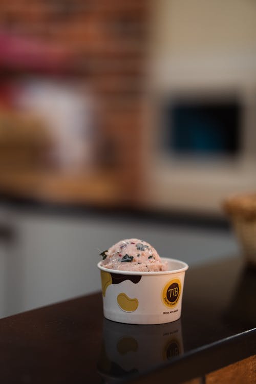 Free White and Yellow Disposable Cup With Ice Cream Stock Photo