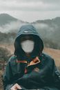 Person in Blue Jacket Wearing Black Mask