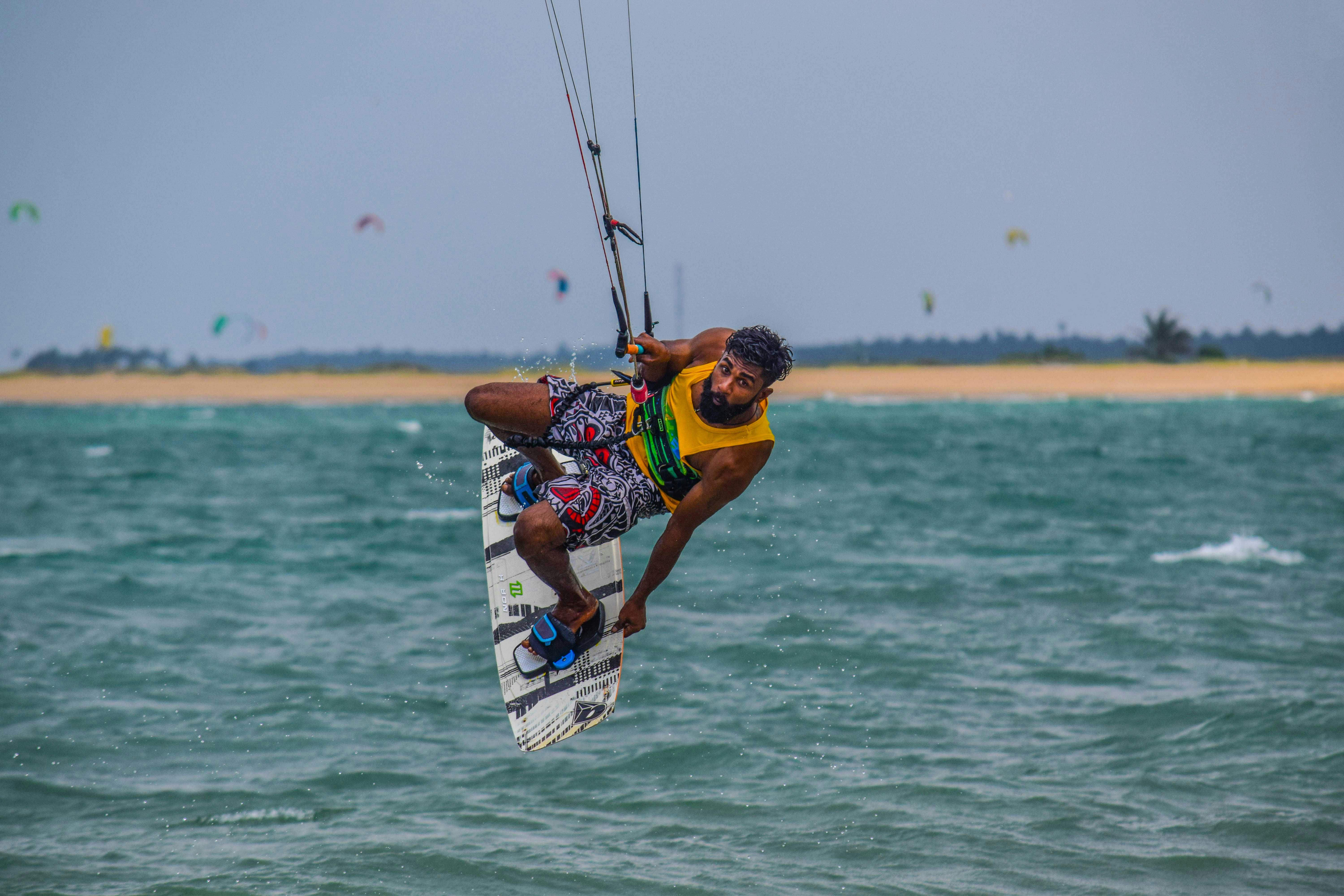 Energetic windsurfing scene on Kalpitiya waters showcasing skill and agility.