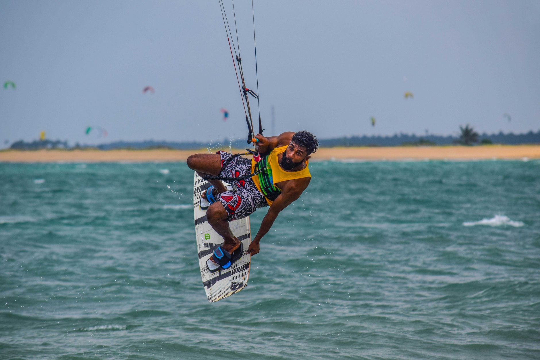 Energetic windsurfing scene on Kalpitiya waters showcasing skill and agility.