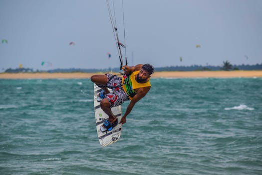 Energetic windsurfing scene on Kalpitiya waters showcasing skill and agility.