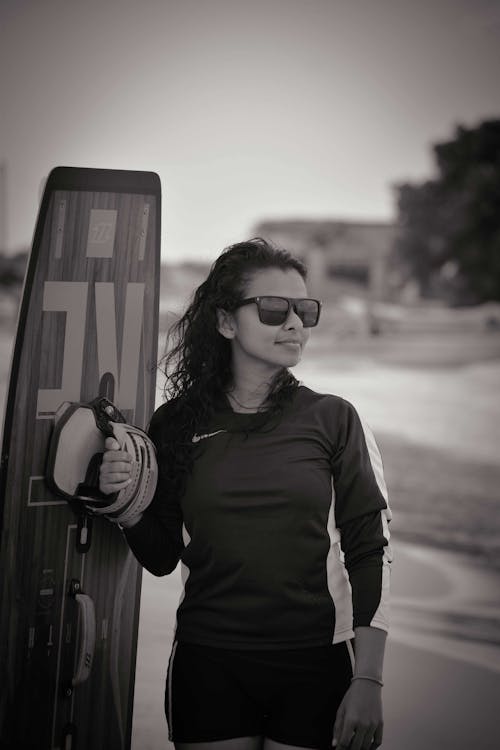 Woman in Black Long Sleeve Shirt Wearing Black Sunglasses