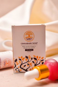 Elegant product shot featuring Monarch's Cinnabari soap with heartwood extract and serum.