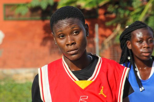 Free Two young women in sports jerseys outdoors, exuding athletic energy. Stock Photo