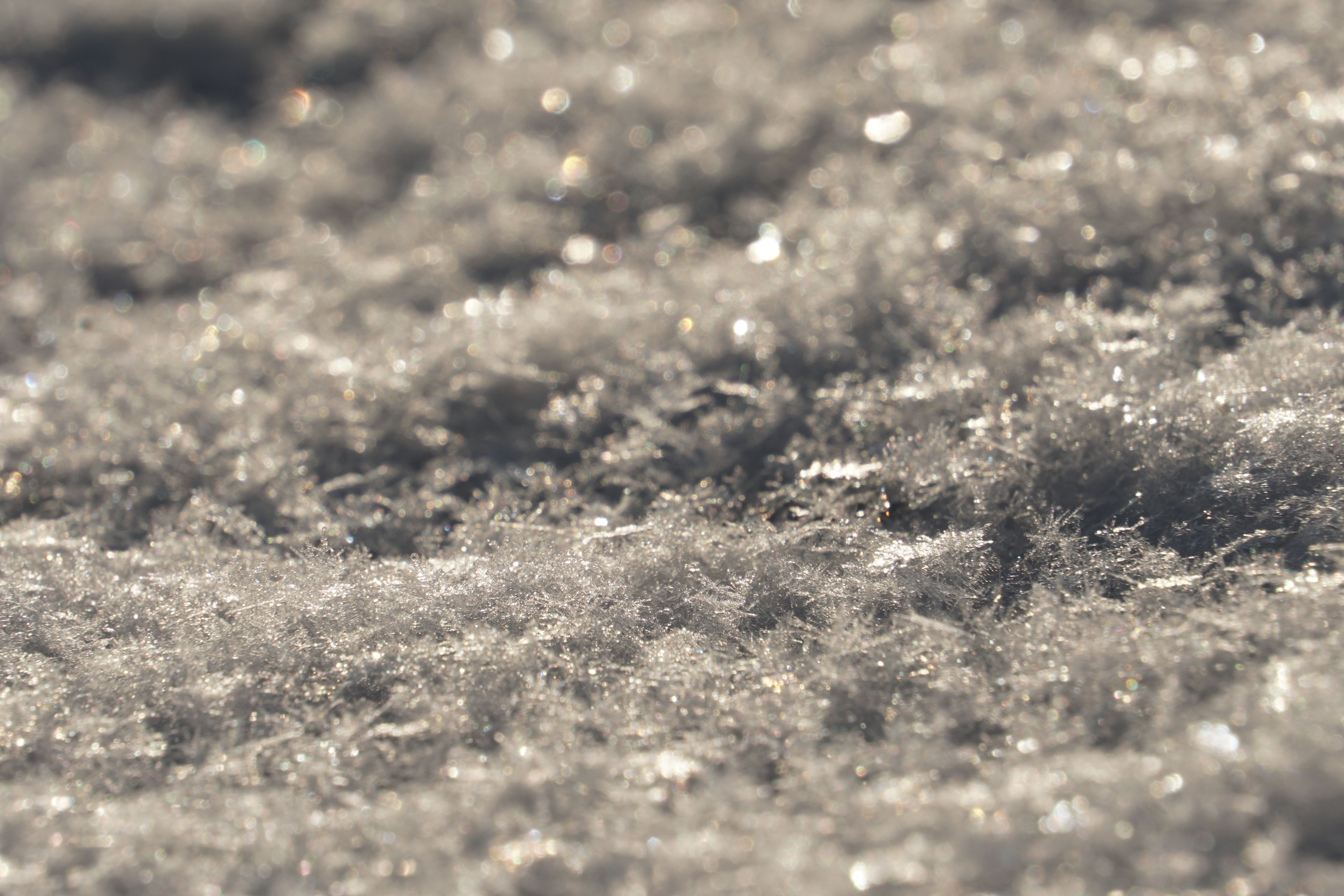 A close-up of a crystal structure illustrating the snowflake formation process.