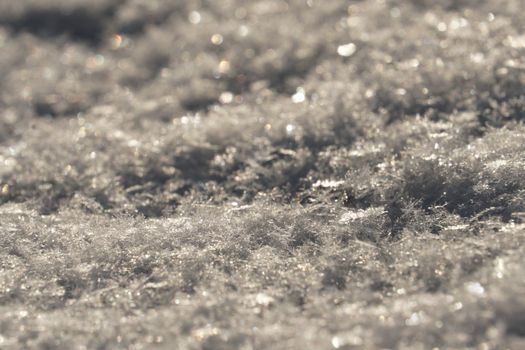 A close-up of a crystal structure illustrating the snowflake formation process.
