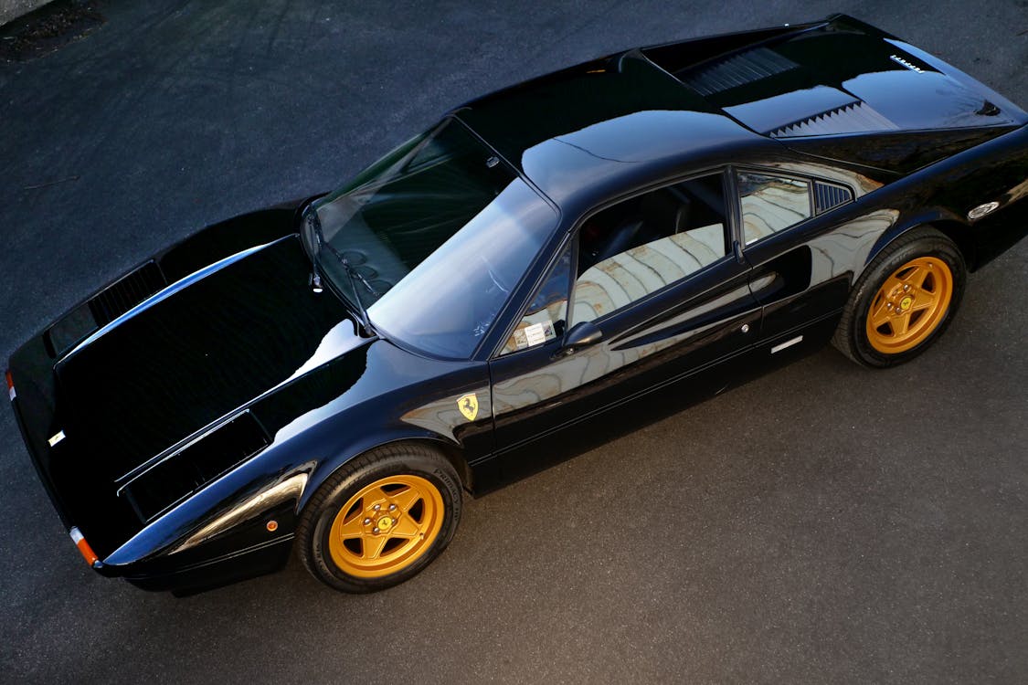 Black Coupe on Gray Surface