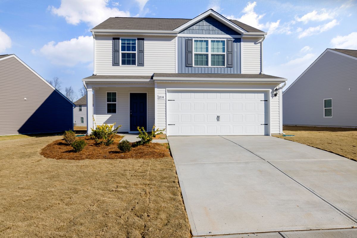 Clean residential vinyl siding home with bright curb appeal