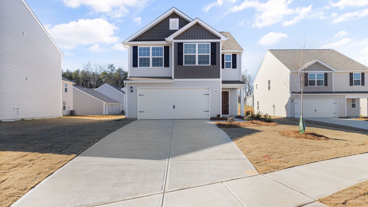 A two-story house in a suburban neighborhood.