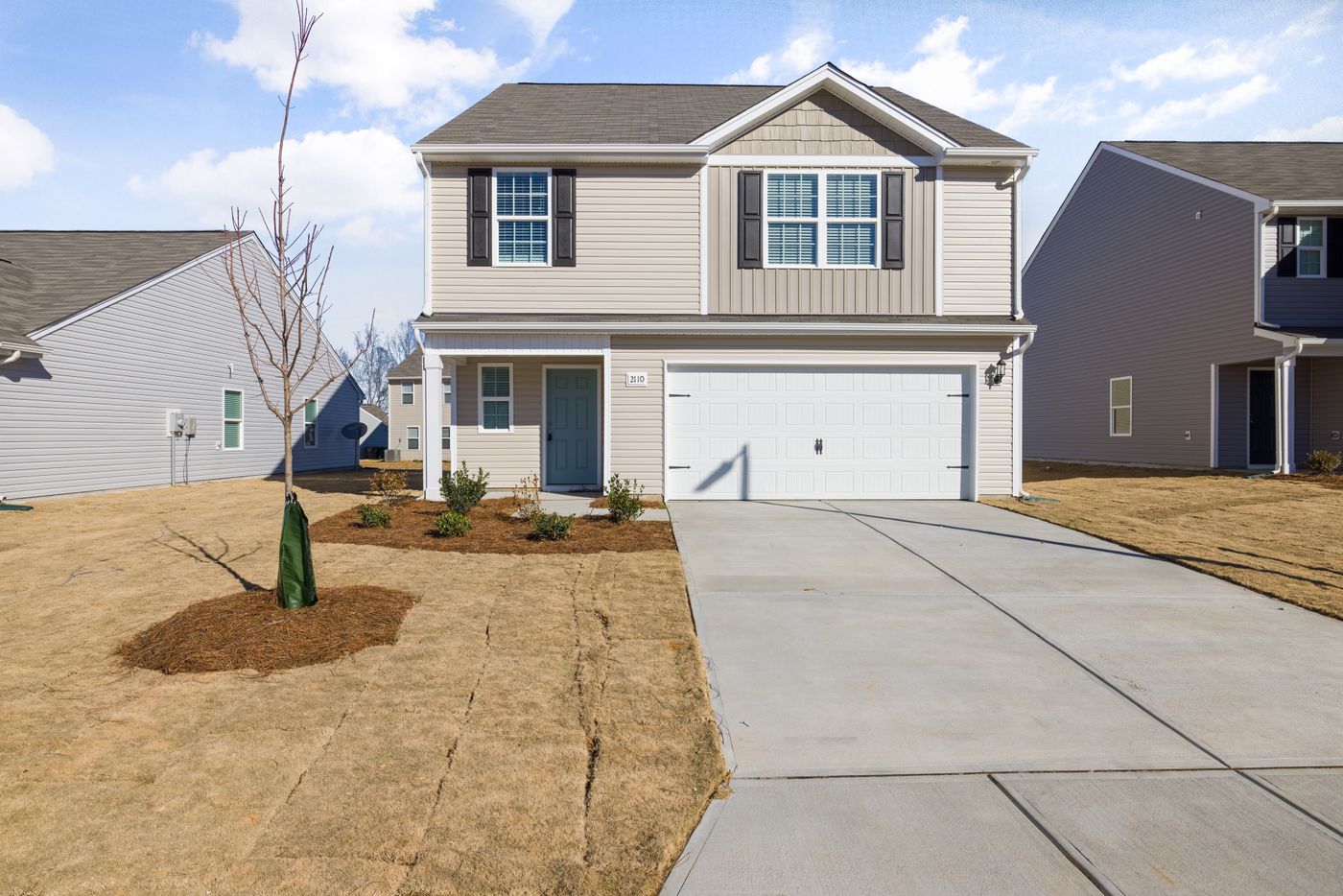 Modern suburban house with driveway and attached garage