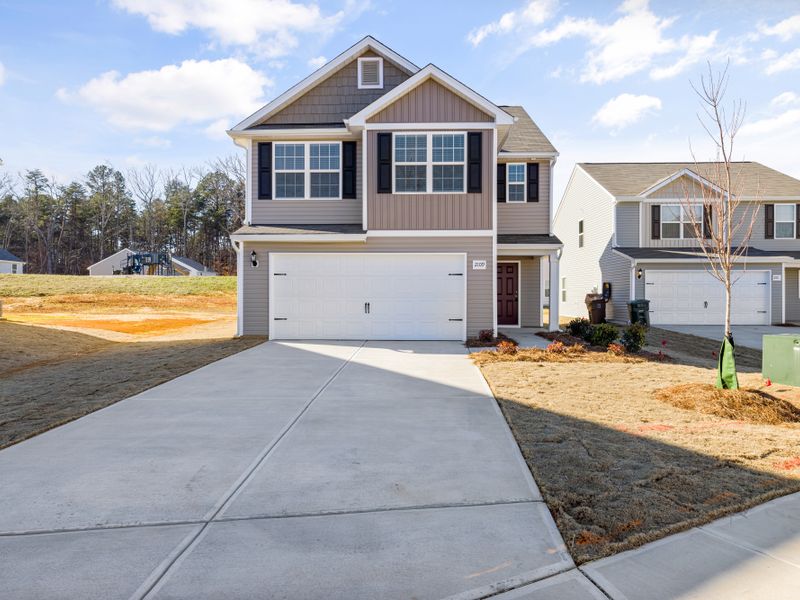 Appliance that needs same-day repair in Maple Valley Contemporary suburban house with a wide driveway and landscaped front yard