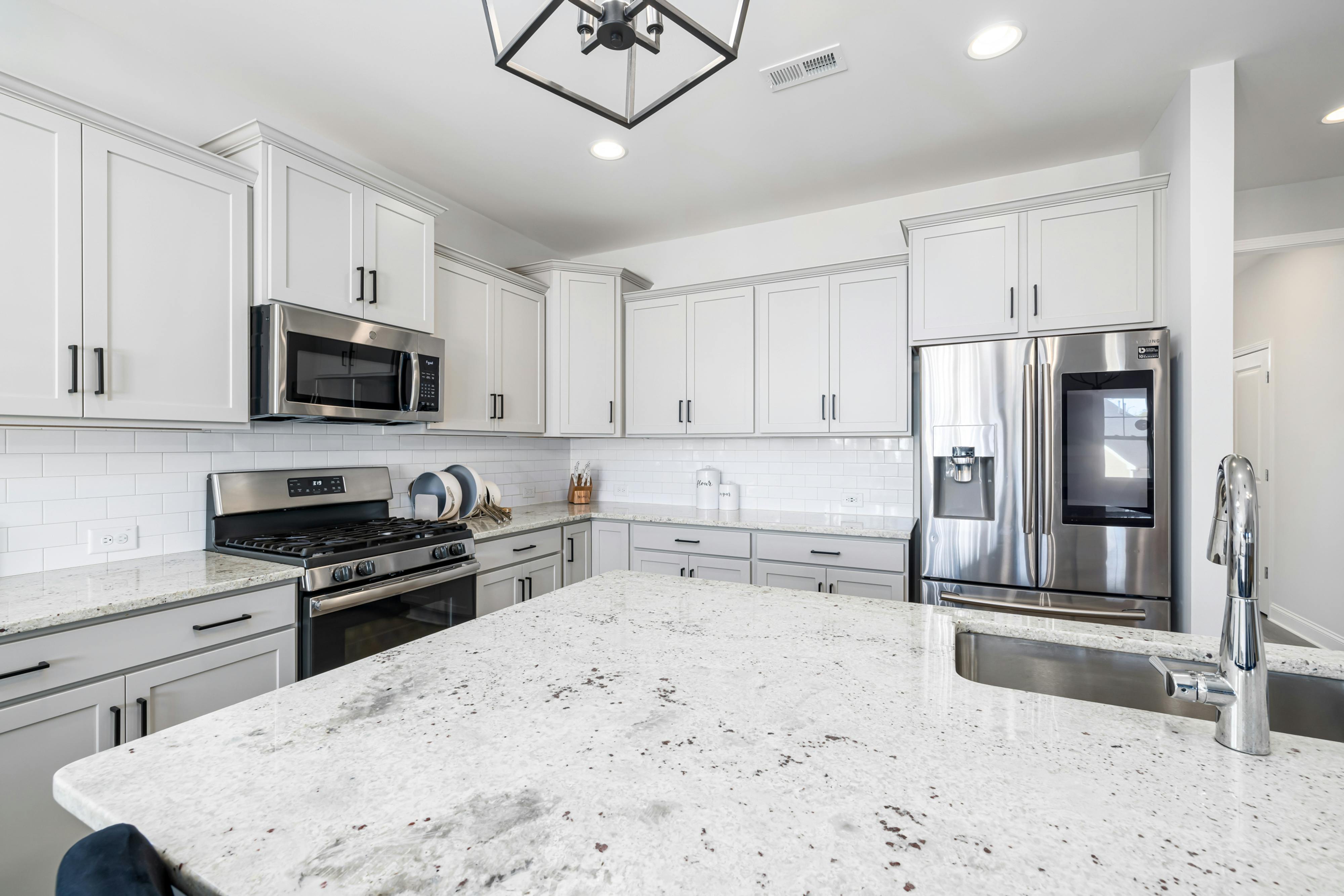 Kitchen Island With Builtin Stove Granite Top And Hood Stock Photo -  Download Image Now - iStock