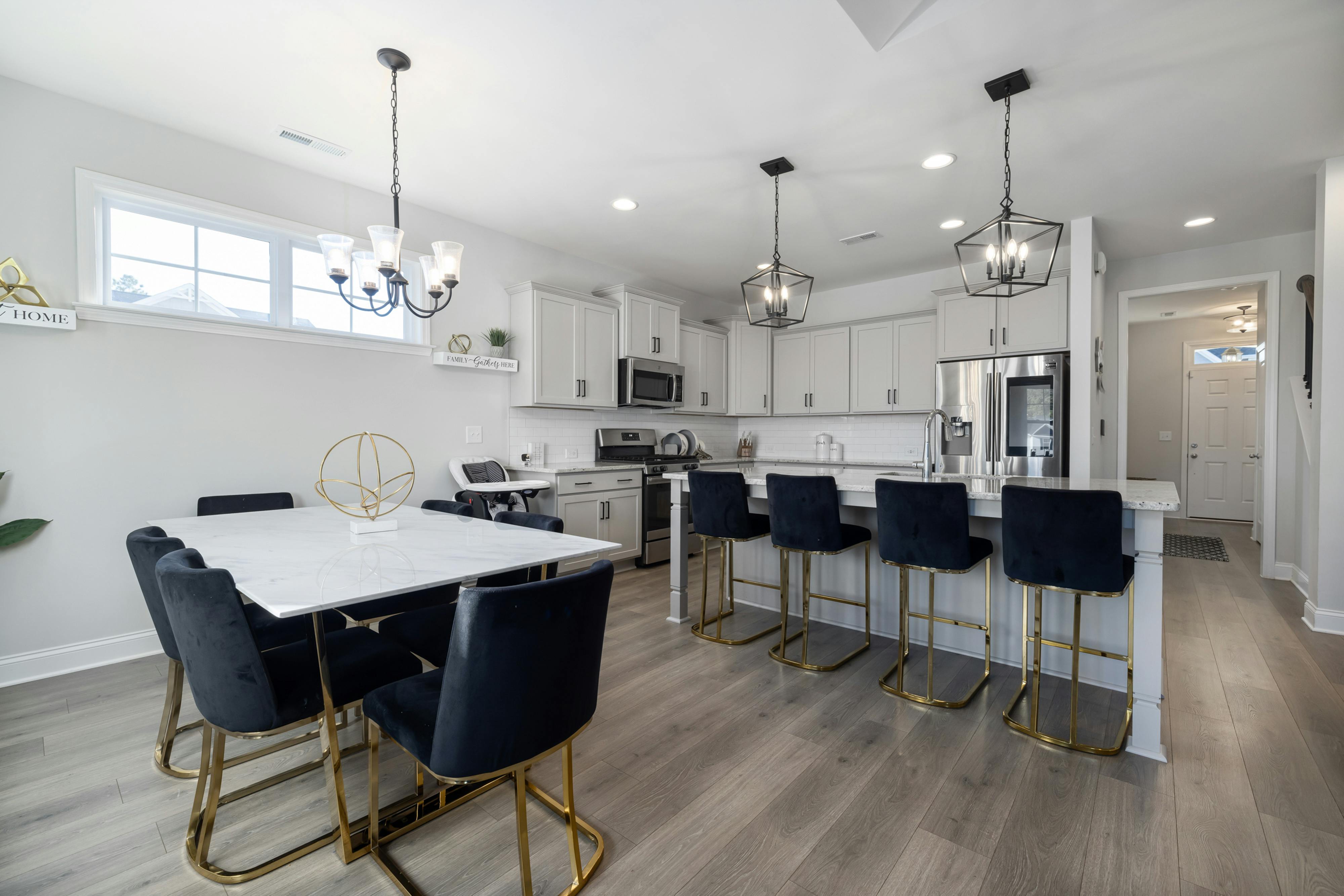 a stylish, modern condo kitchen with high-end appliances and an open-concept layout - condos for sale in houghton wa