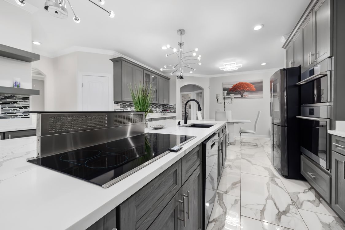Kitchen with integrated dining area Kitchen with a dining table and warm atmosphere