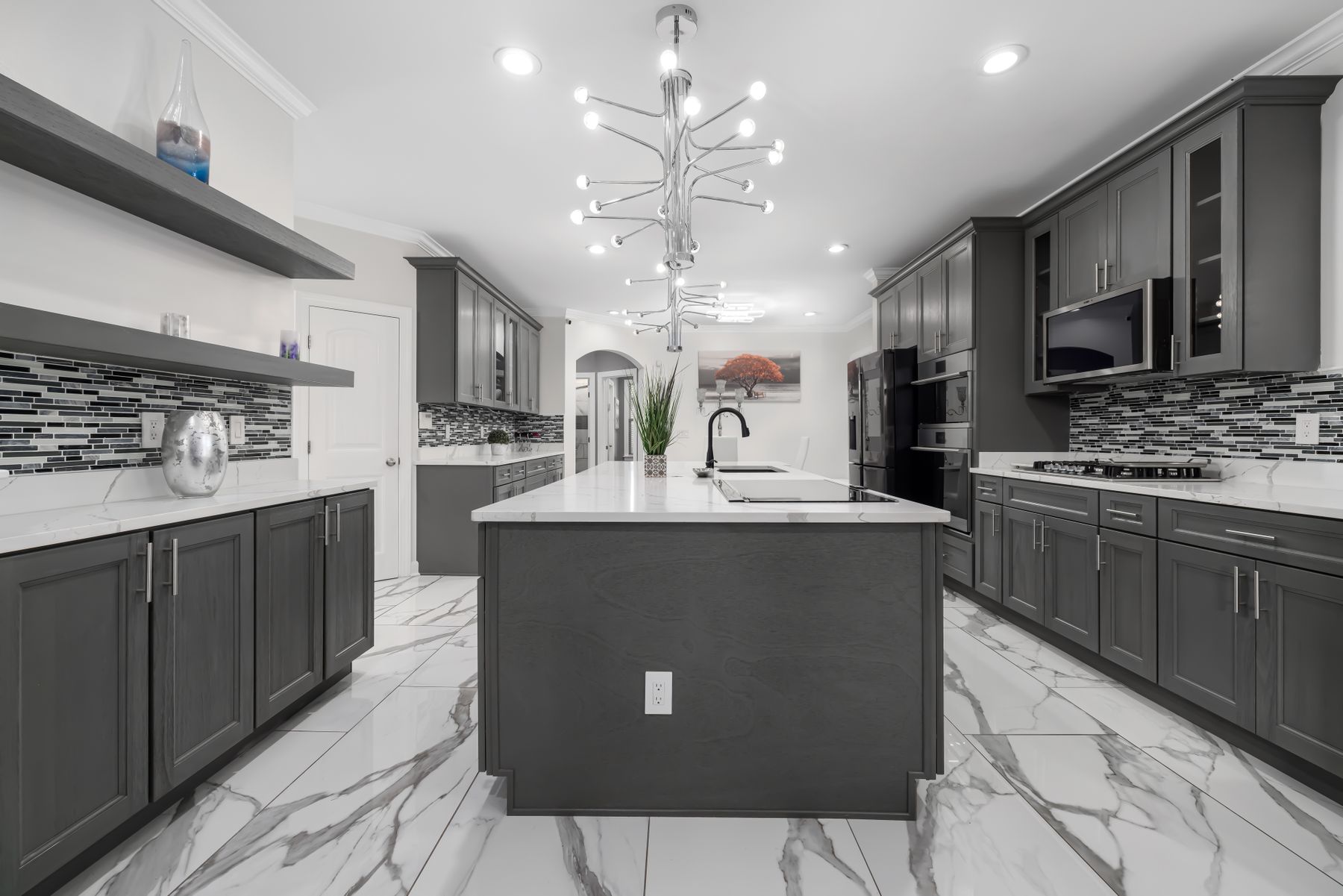 Contemporary modular kitchen in graphite grey with a marble-topped island