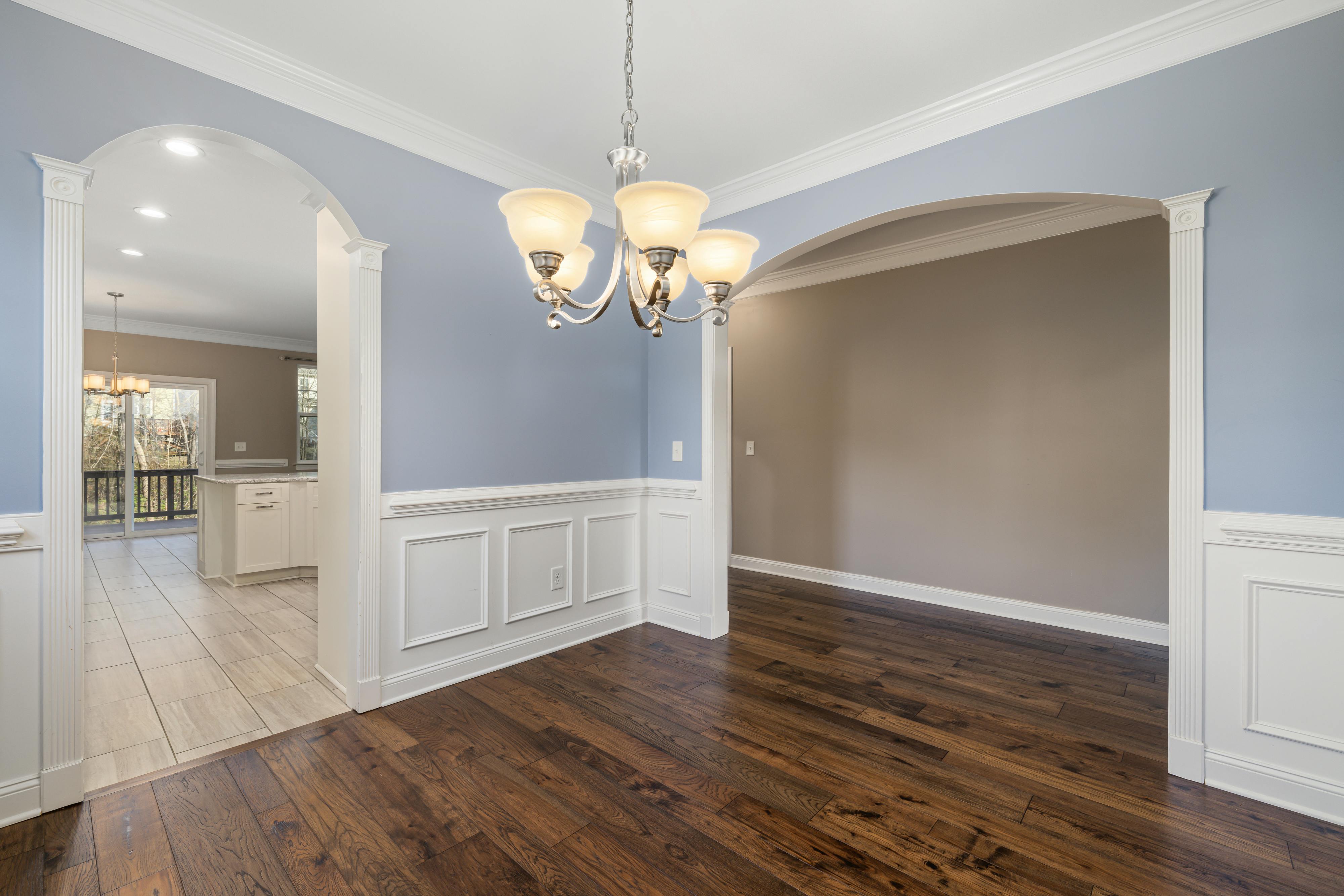 Architectural Moldings In A Minimalist Bedroom With Box Molding And Wainscoting, Painted In The Same Color As The Walls, Showcasing Depth And Sophistication