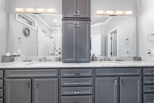 Free Sleek gray bathroom with dual sinks and marble countertop, showcasing modern design. Stock Photo