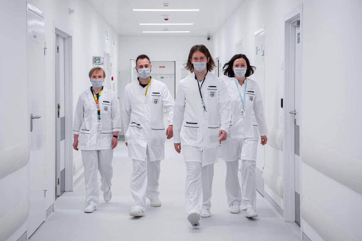 Doctors walking through hospital