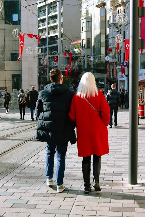 A Couple Walking in a City