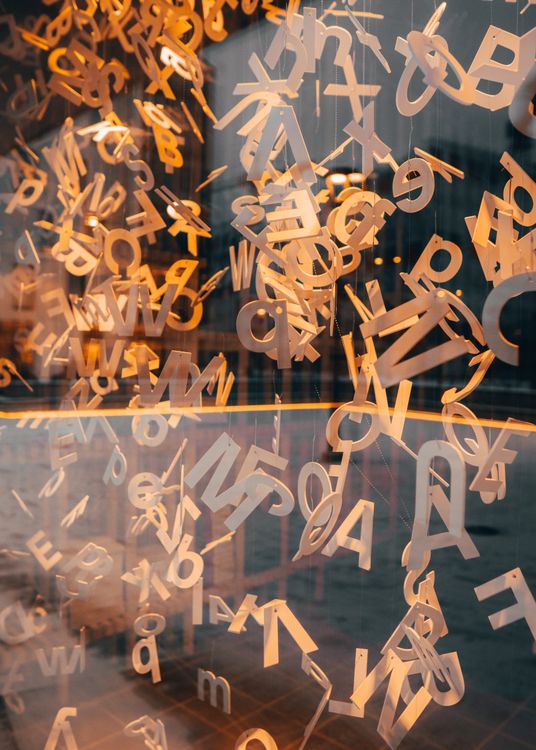 Wooden Alphabets Hanging Near Glass Window · Free Stock Photo