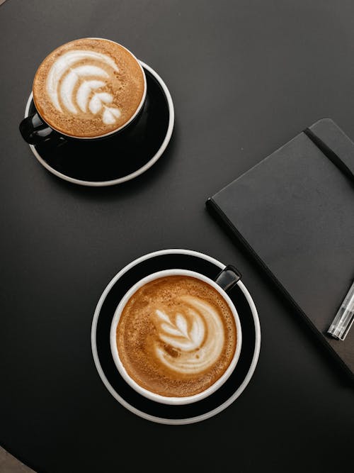 Free Cups of Coffee and Notebook Stock Photo