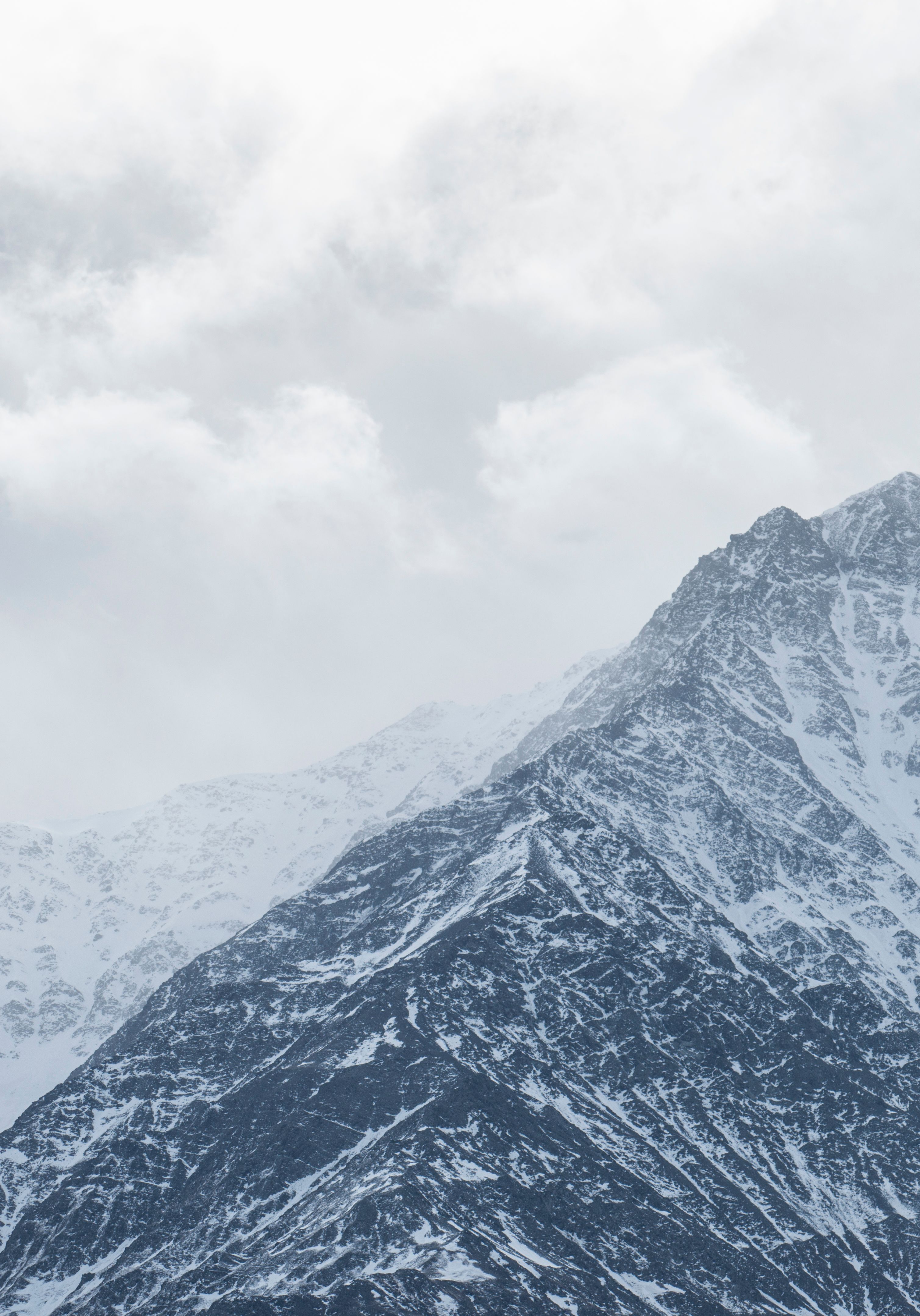 White Clouds Covering Rocky Mountain · Free Stock Photo