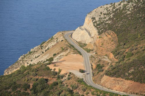 Aerial View of Road on Cliff by the Sea