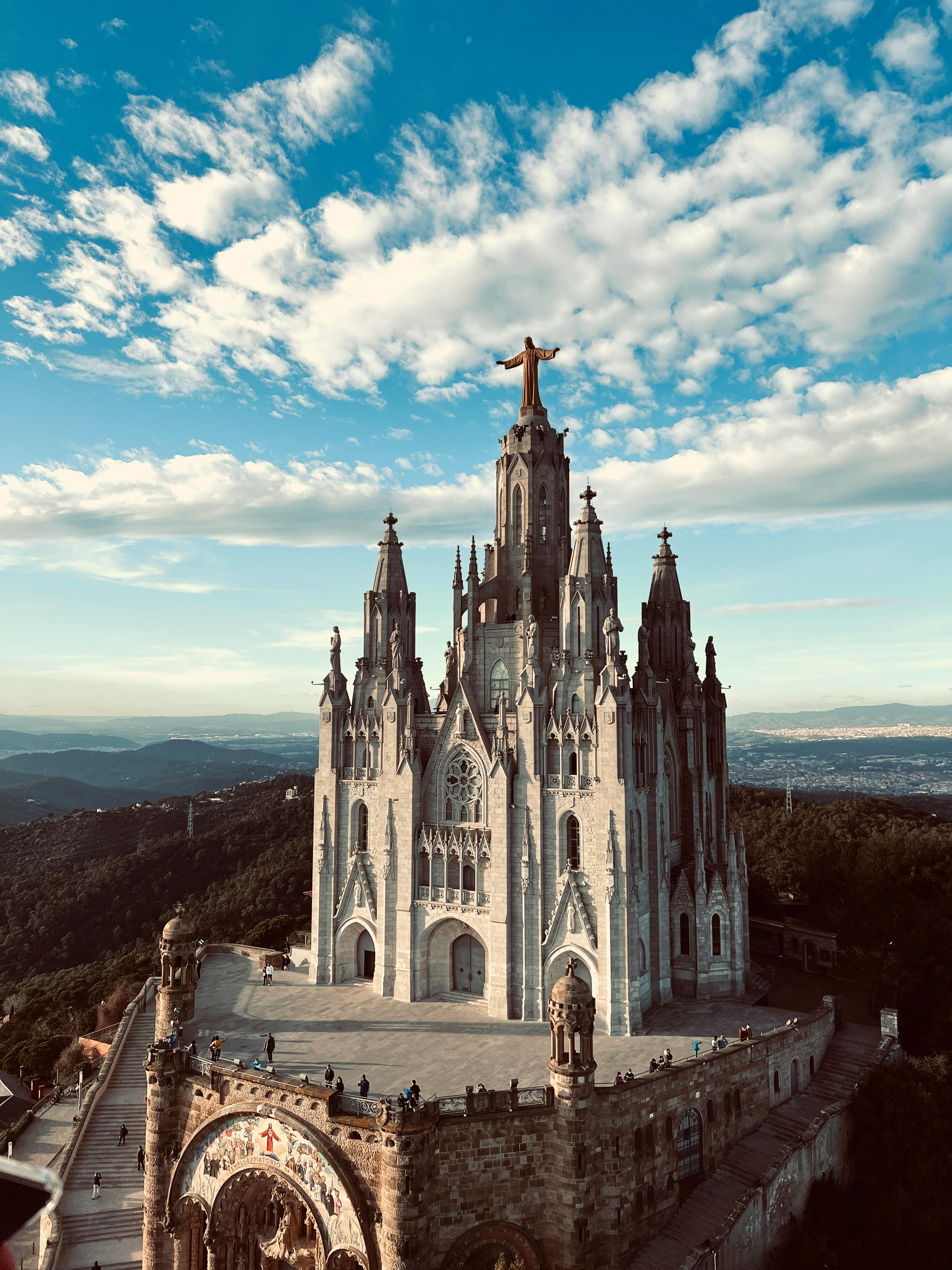 an aerial shot of the church of the sacred heart in the serra de collserola natural park barcelona spain