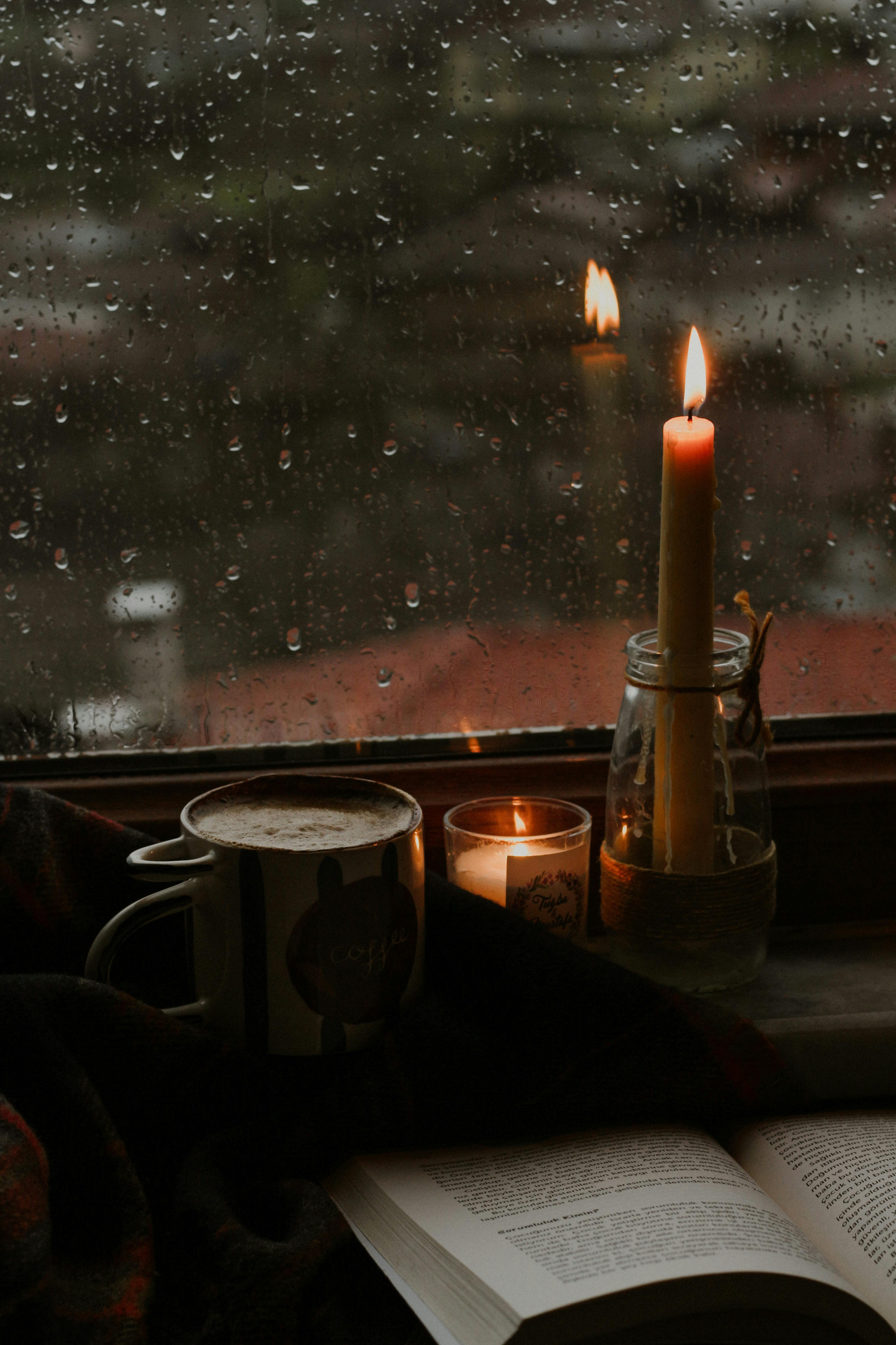 Free Lighted Candles By the Window Stock Photo