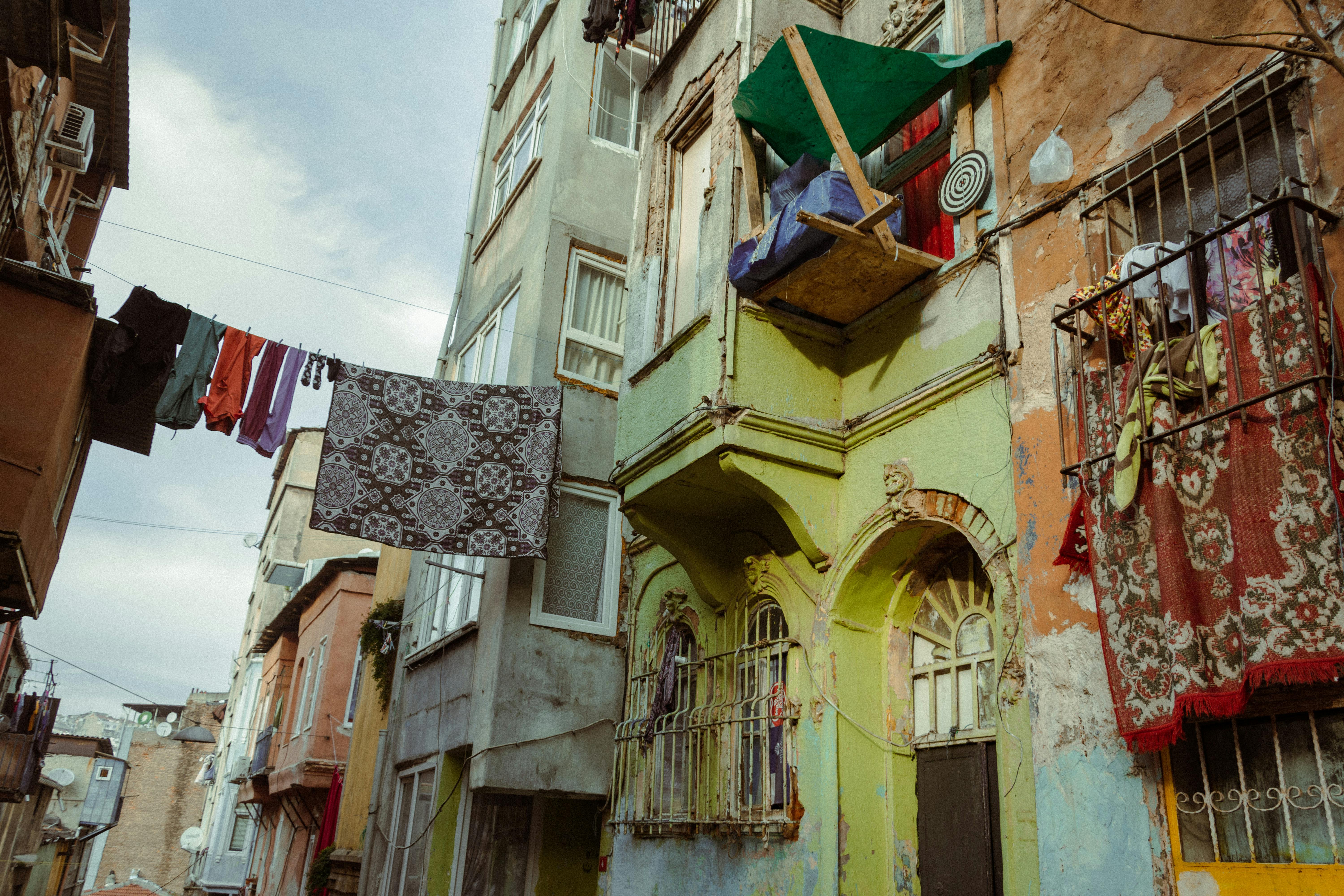 Clothes Hanging on Clothesline in Between Buildings · Free Stock Photo