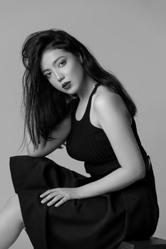 Stunning black and white portrait of a woman in a studio setting.