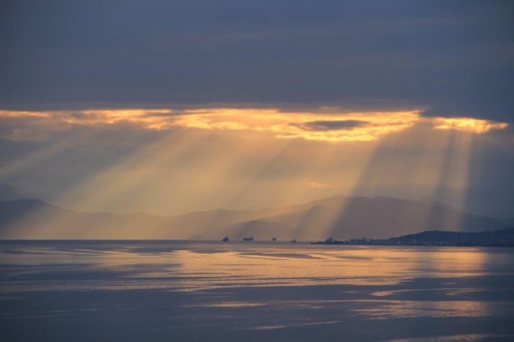 Rays Of Sunlight Shining Through Clouds