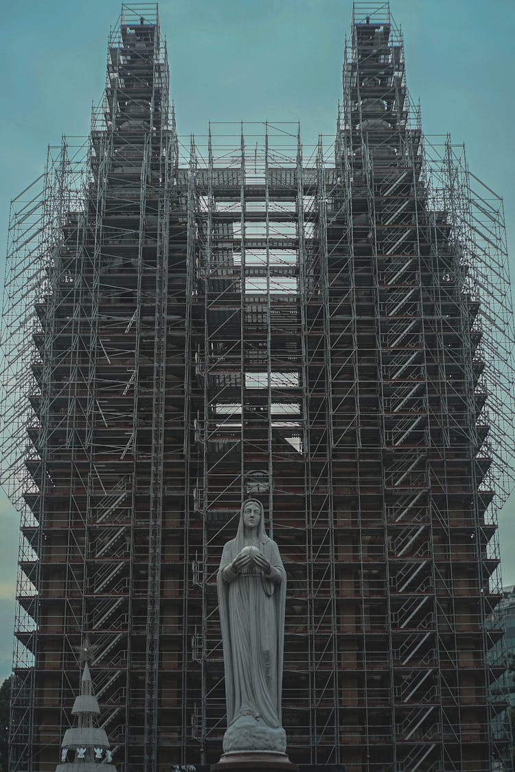 Statue In Front Of Building Construction In Saigon, Vietnam