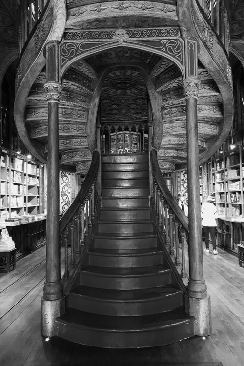 Free Black and white photo of the iconic spiral staircase inside Lello Bookstore, Porto, Portugal. Stock Photo