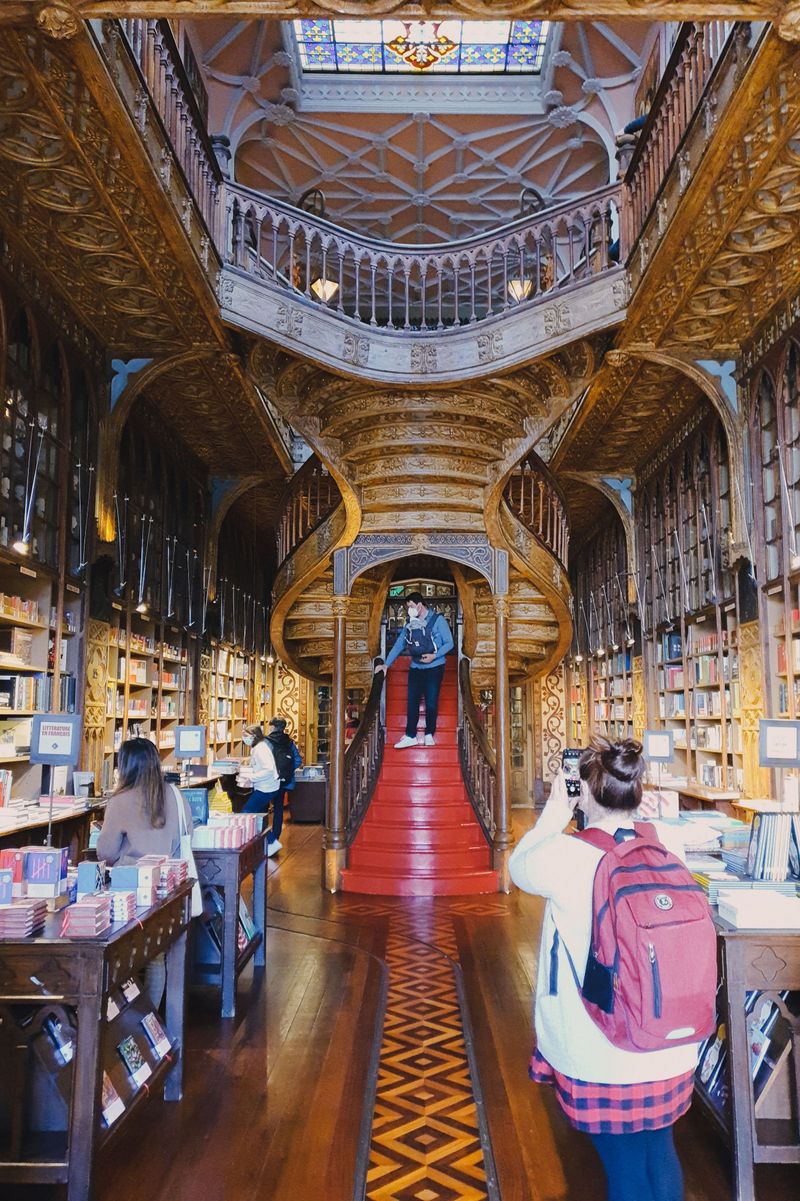 Art nouveau interior and red staircase of Livraria Lello bookstore in Porto